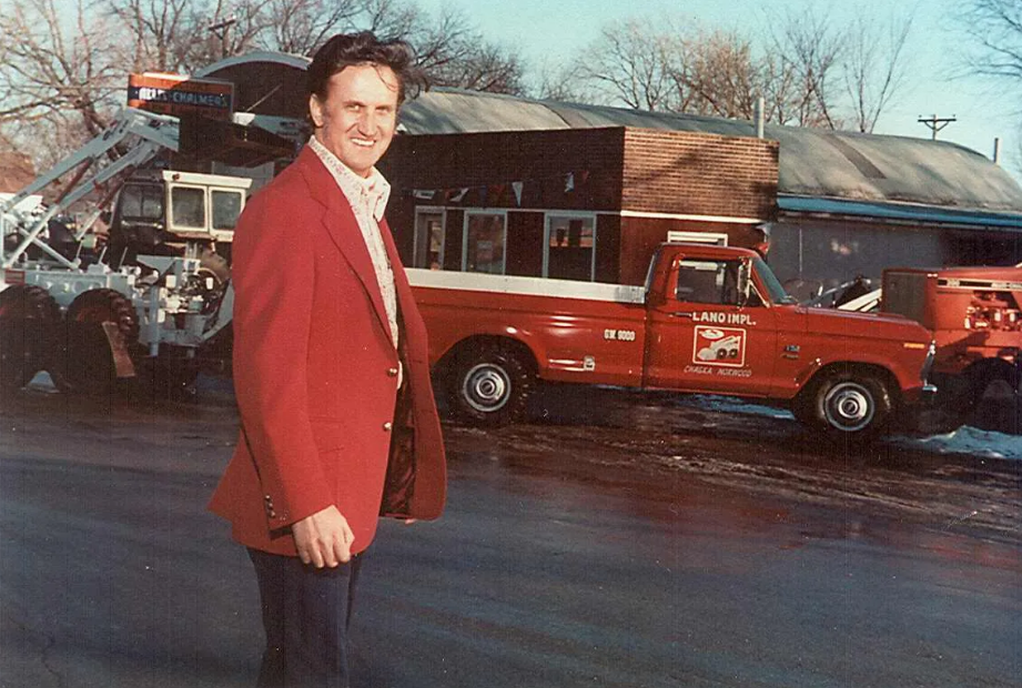 Hauser Lano at the Chaska facility in the late 1950s with new Melroe Bobcat loader in the background.